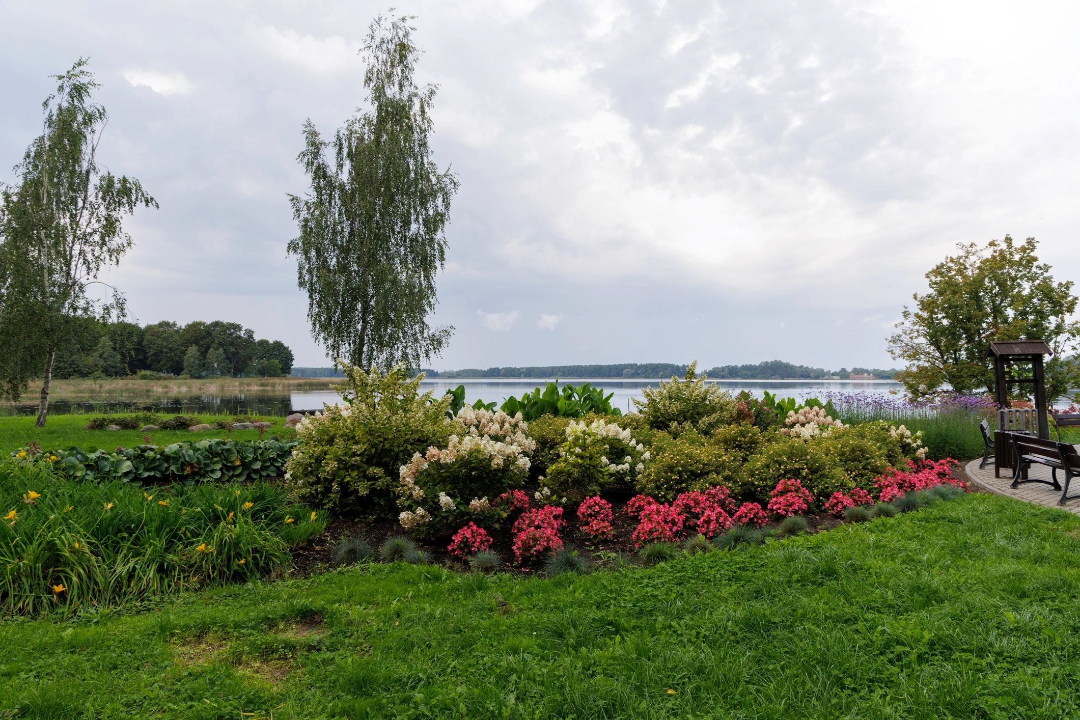 Well-maintained landscaped garden with lawn and flowerbeds